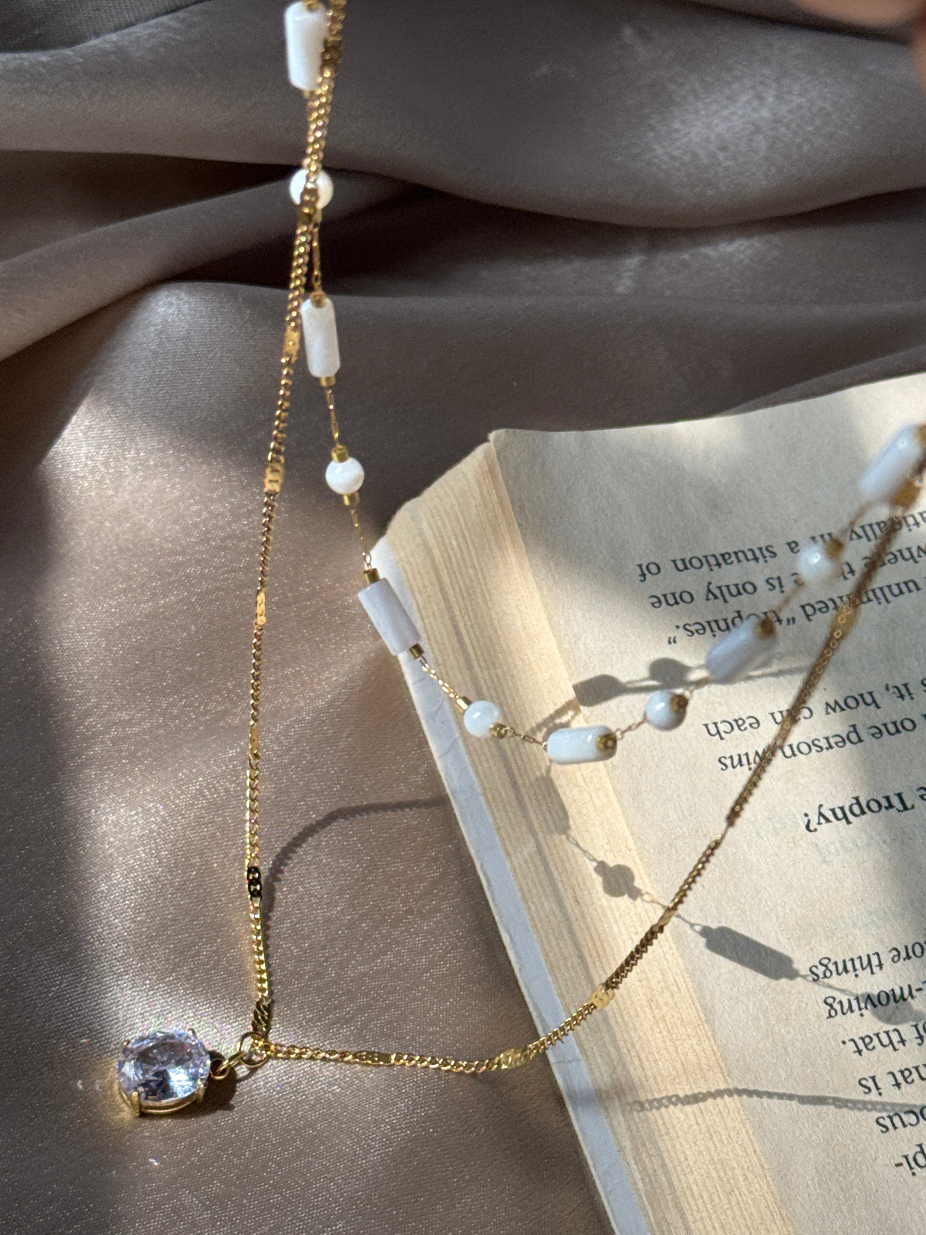 White beaded double chain with pendant