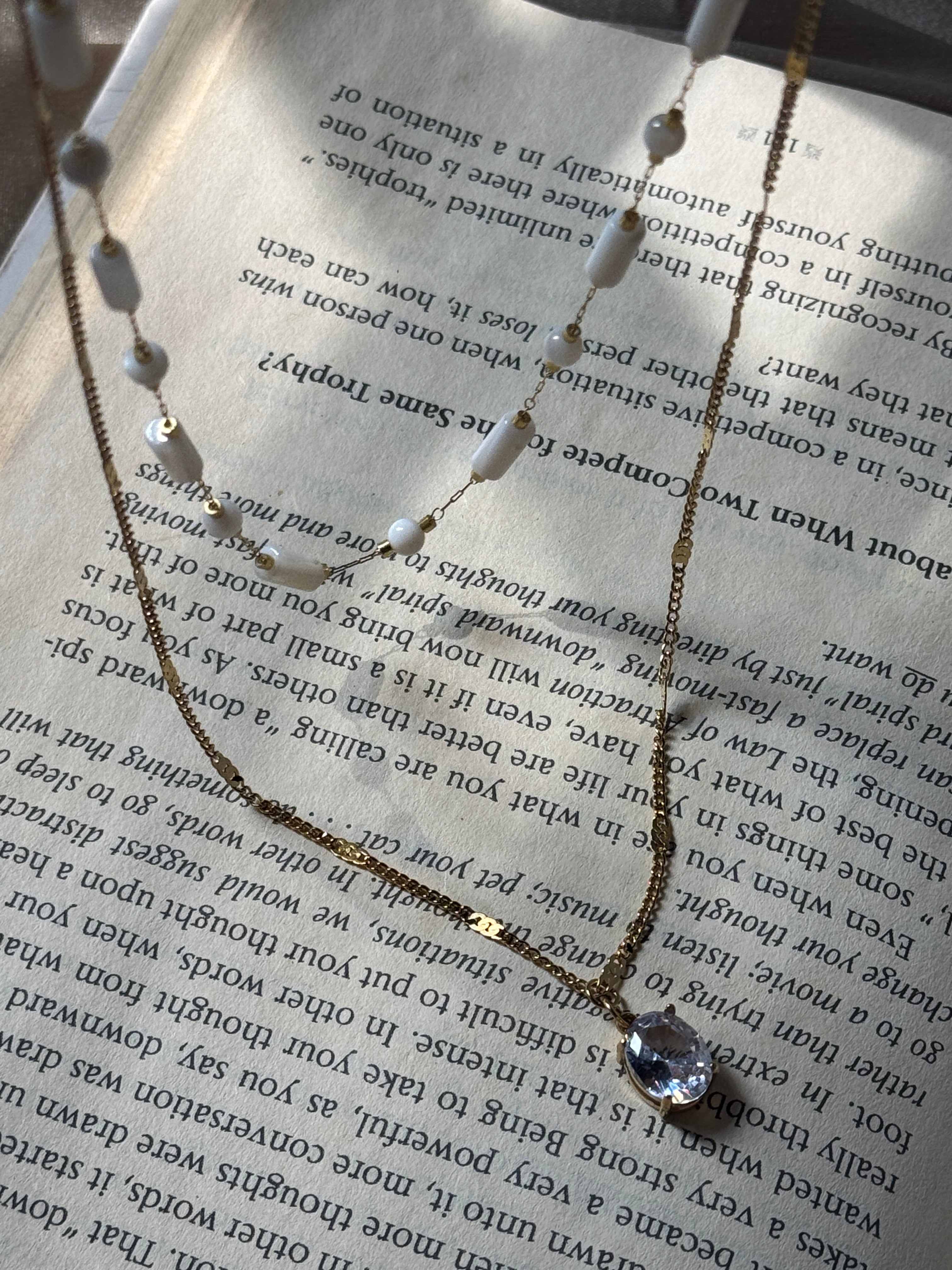 White beaded double chain with pendant