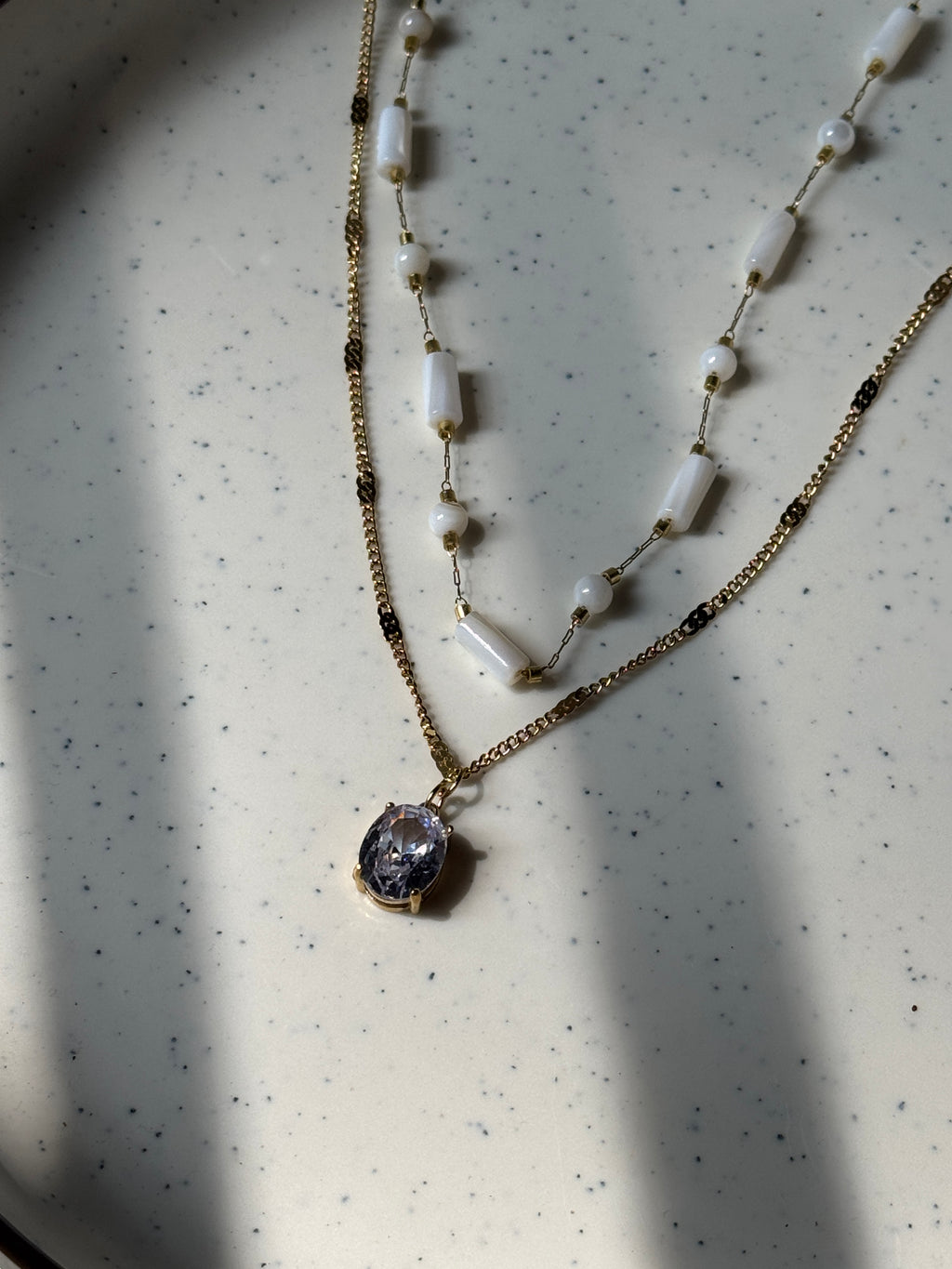 White beaded double chain with pendant