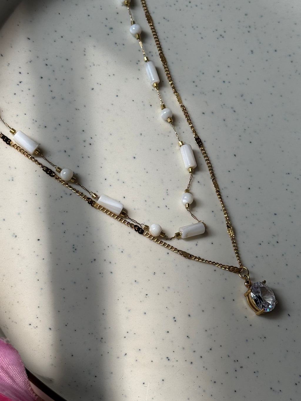 White beaded double chain with pendant
