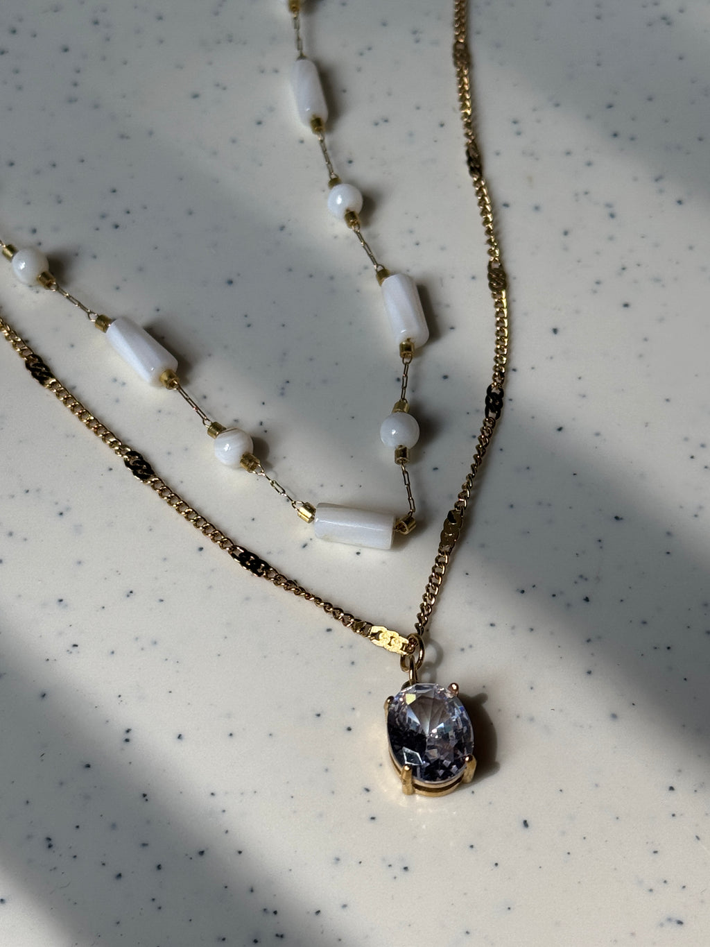 White beaded double chain with pendant